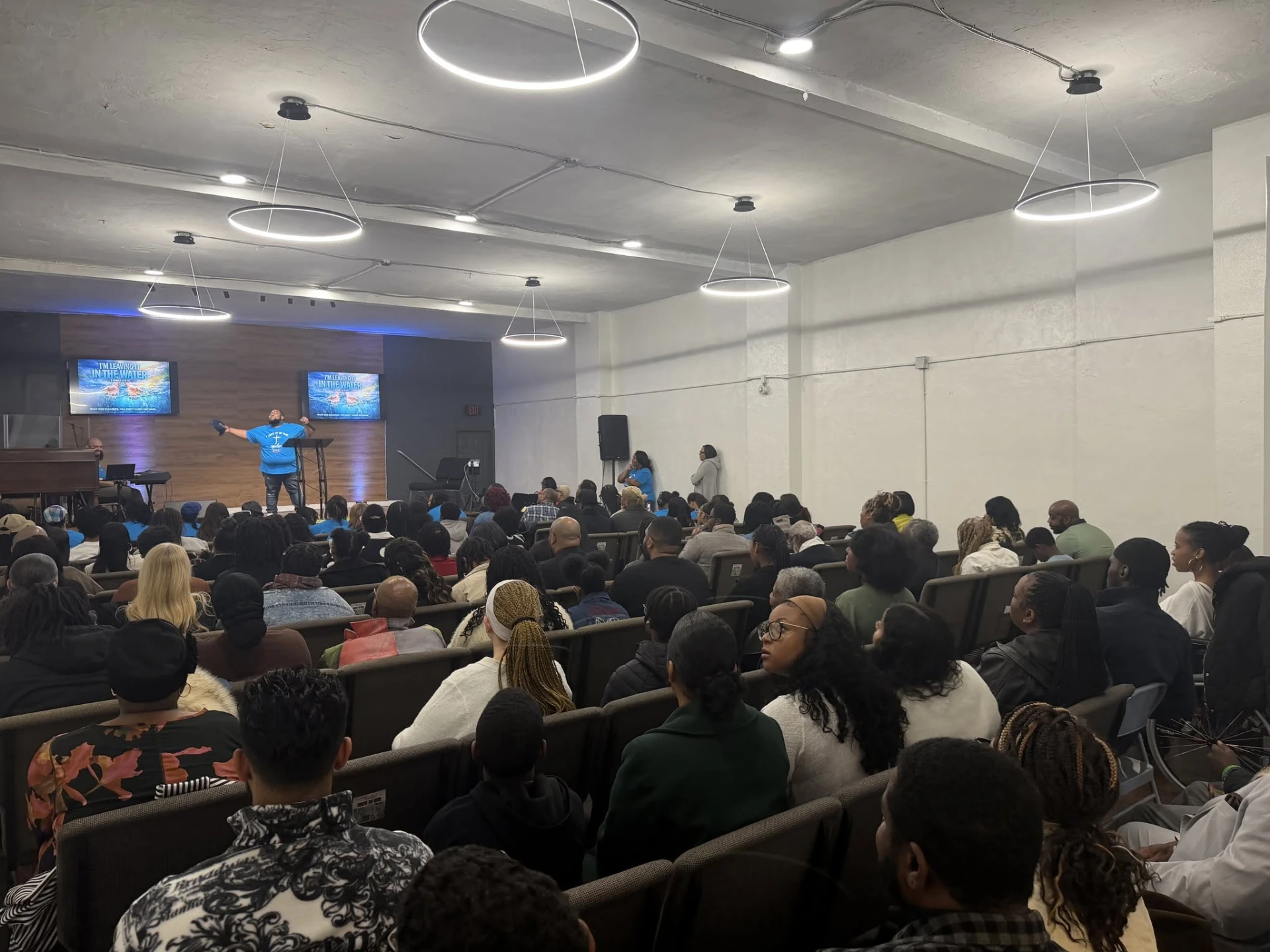 Greater Harvest Fellowship congregation worshipping in the Philadelphia church sanctuary